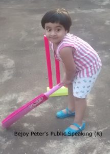 Daniela B. Peter playing cricket on terrace evening